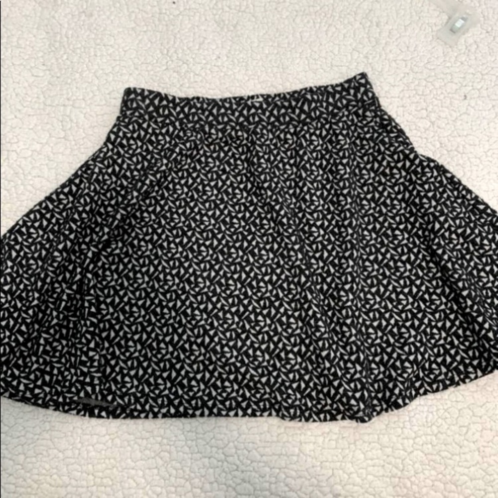 Blacks no white patterned skirt